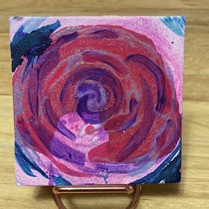 Abstract art representation of rose with hologram powder and alcohol ink.